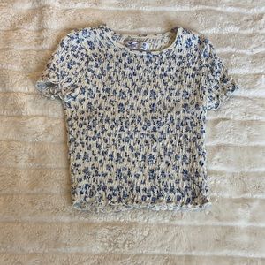This is a cute floral blue and white crop top from Hollister!